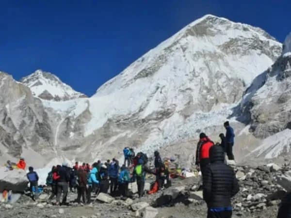 Trekkers with packed bags at Everest Base Camp